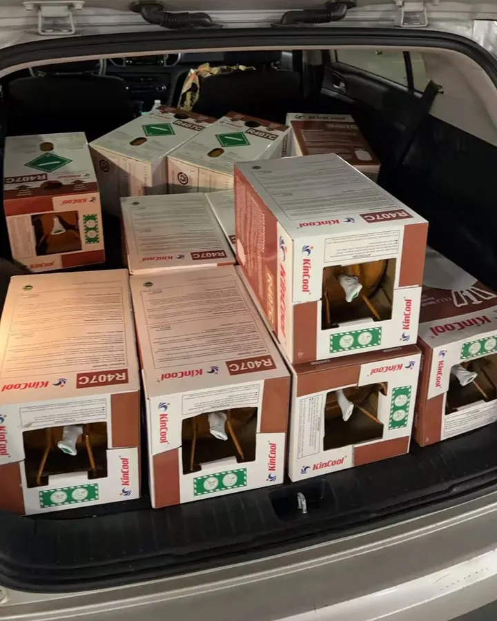 Customer vehicle loaded with packaged refrigerant order